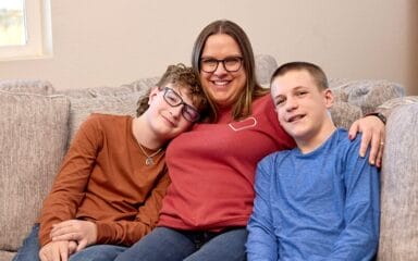 mom with kids hugging them