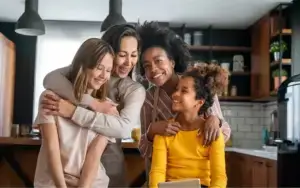 Family in their kitchen smiling