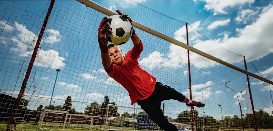 Student playing soccer